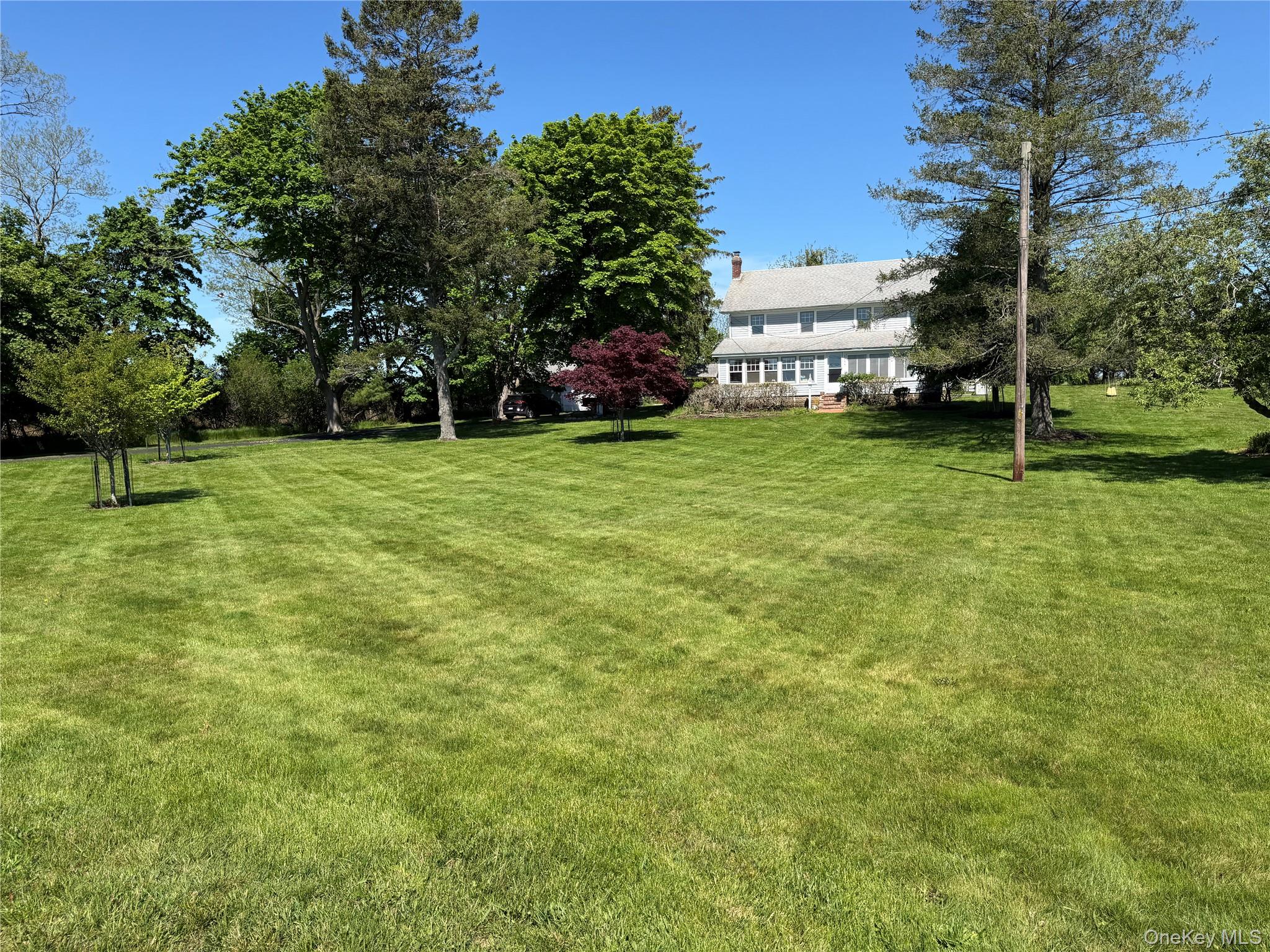 1055 Oregon Road Mattituck, NY 11952 - Photo 2 of 33 Nestled on 1.46 Acre Front Yard with Southern Exposure