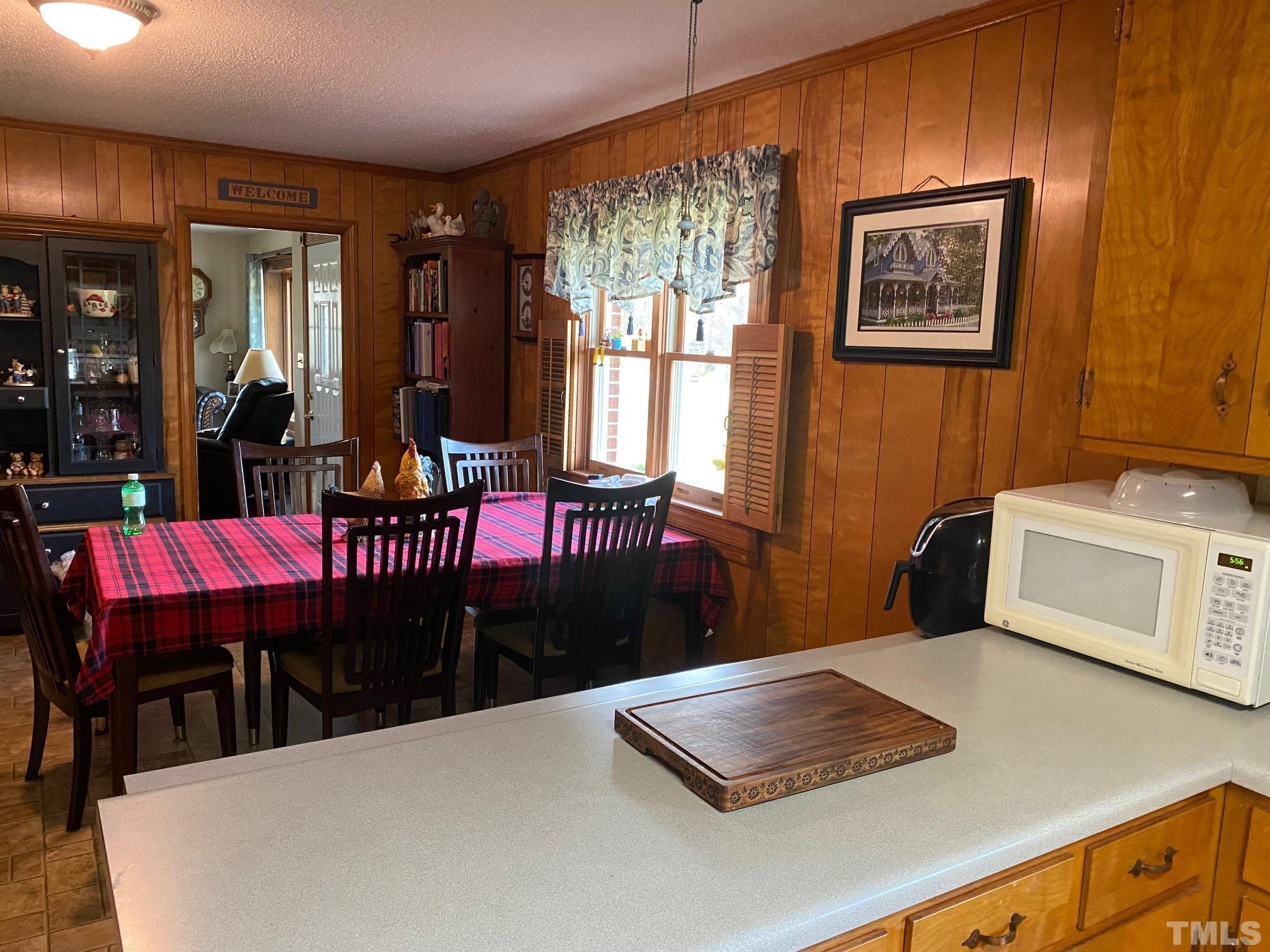 402 Stallings Road Zebulon, NC 27597 - Photo 9 of 14 a view of a dining room with furniture window and outside view