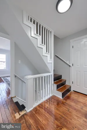 a view of entryway with wooden floor