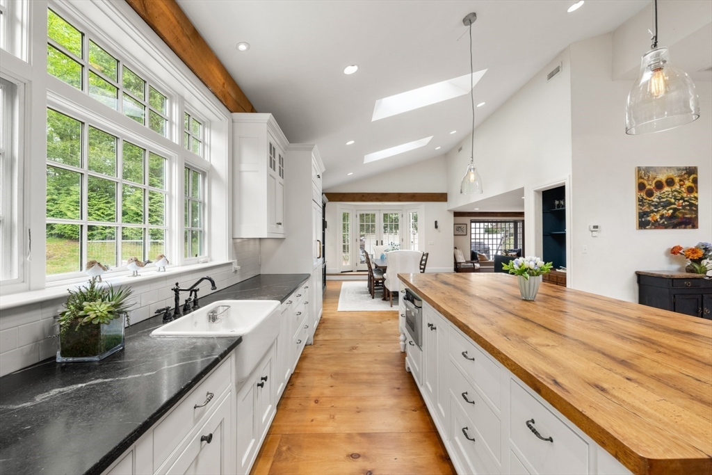 41 Longmeadow Road Wellesley, MA 02482 - Photo 11 of 41 a large kitchen with kitchen island granite countertop a large window and stainless steel appliances