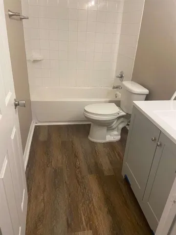 a bathroom with a toilet and a shower