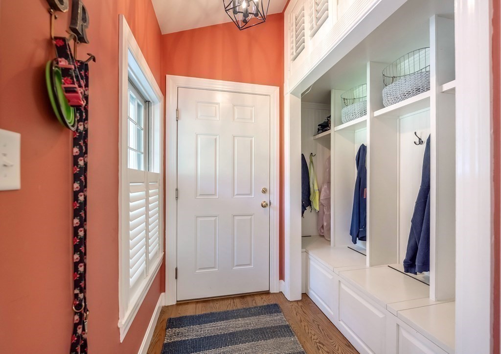 237 Highland Road Andover, MA 01810 - Photo 17 of 42 a view of a hallway with wooden floor and entryway