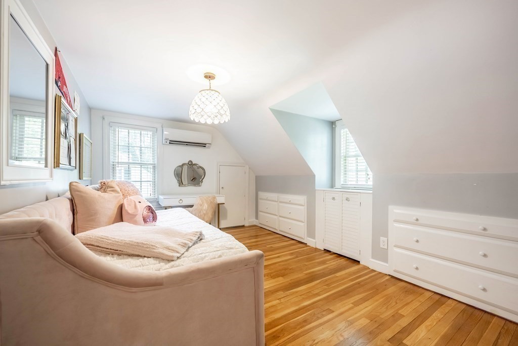 237 Highland Road Andover, MA 01810 - Photo 24 of 42 a living room with furniture and a mirror