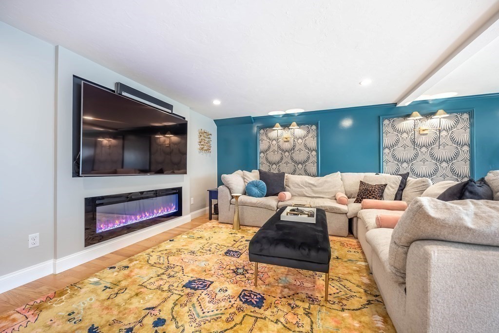 237 Highland Road Andover, MA 01810 - Photo 29 of 42 a living room with furniture and a flat screen tv