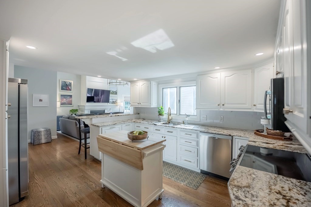 237 Highland Road Andover, MA 01810 - Photo 6 of 42 a kitchen with a stove a sink and a refrigerator