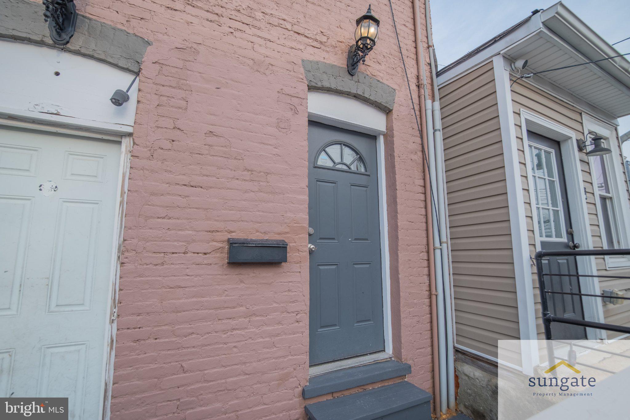4032 Falls Road, Unit 2 Baltimore, MD 21211 - Photo 27 of 30 a brick house with a door and a door
