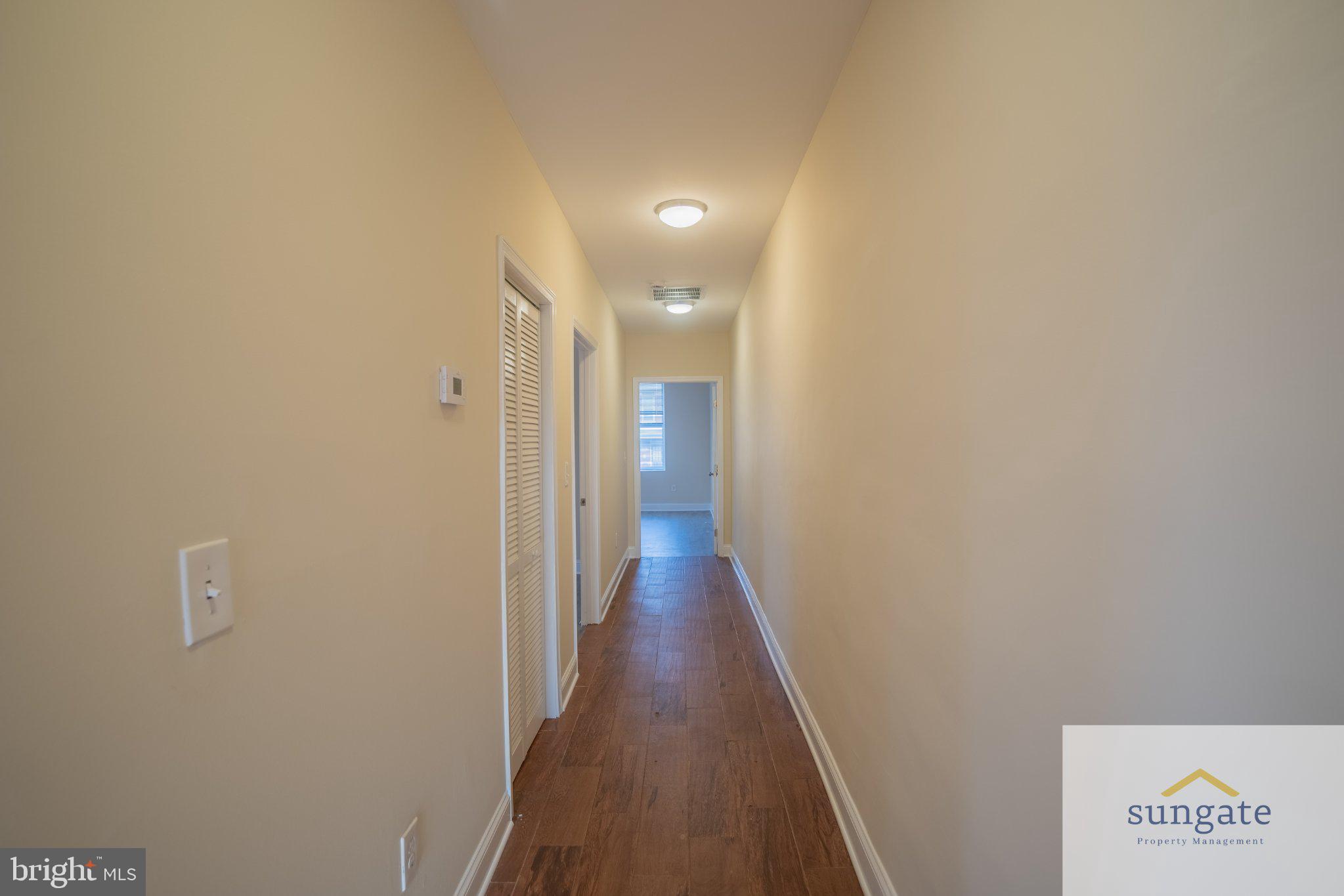 4032 Falls Road, Unit 2 Baltimore, MD 21211 - Photo 9 of 30 a view of a hallway with wooden floor