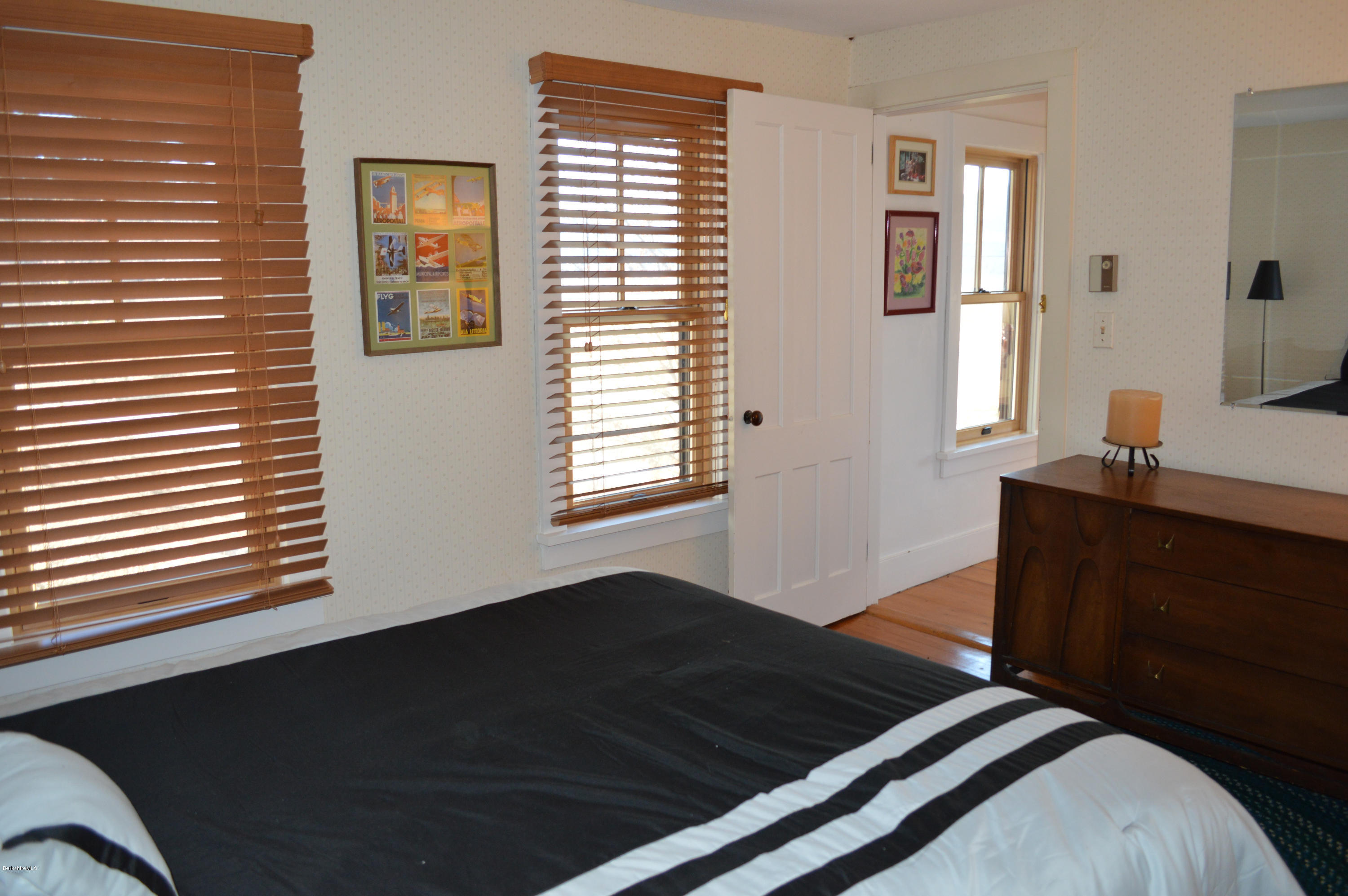 151 Main Road Tyringham, MA 01264 - Photo 14 of 62 a bedroom with a bed and a window