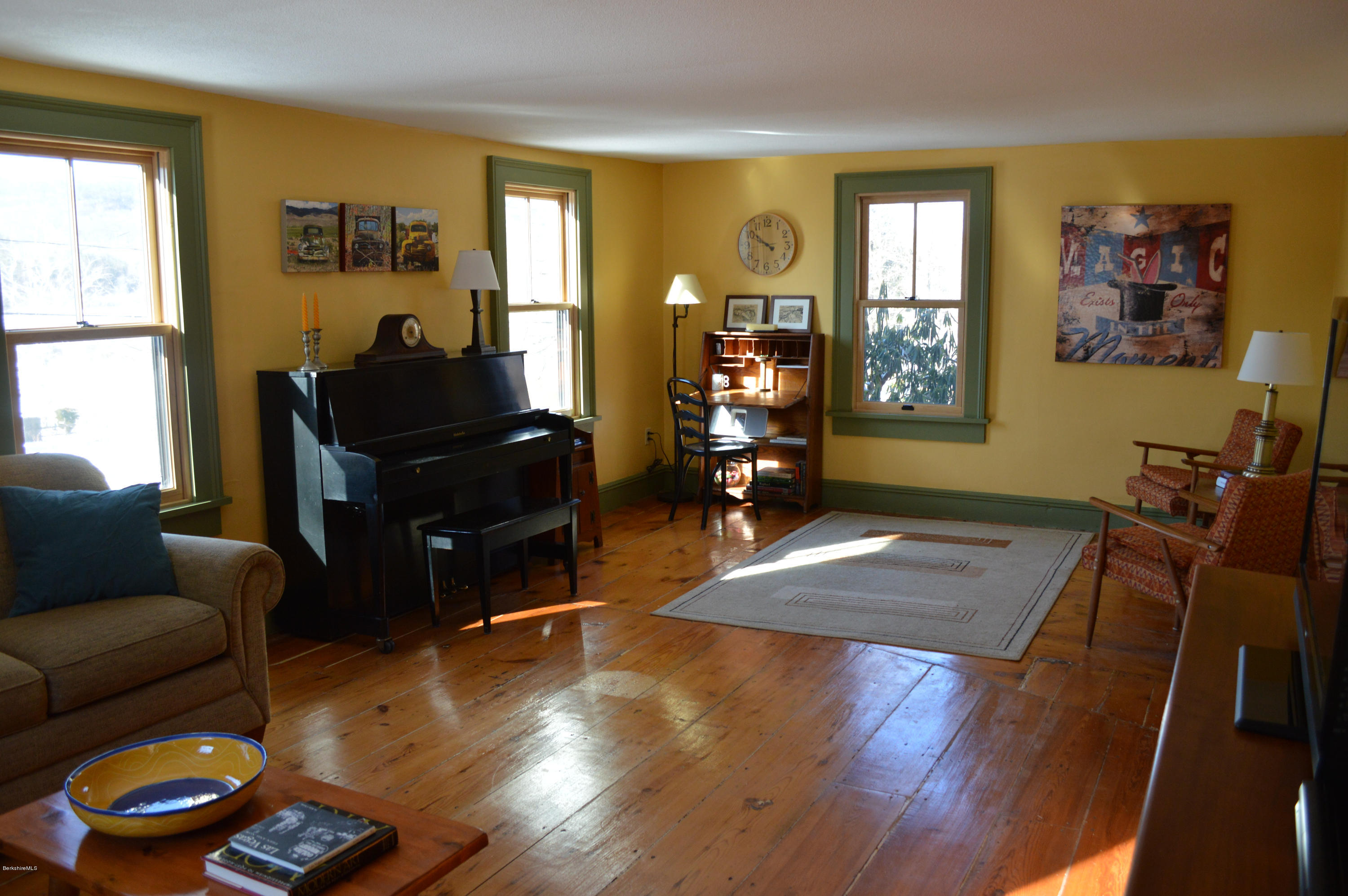 151 Main Road Tyringham, MA 01264 - Photo 40 of 62 a living room with furniture and a window