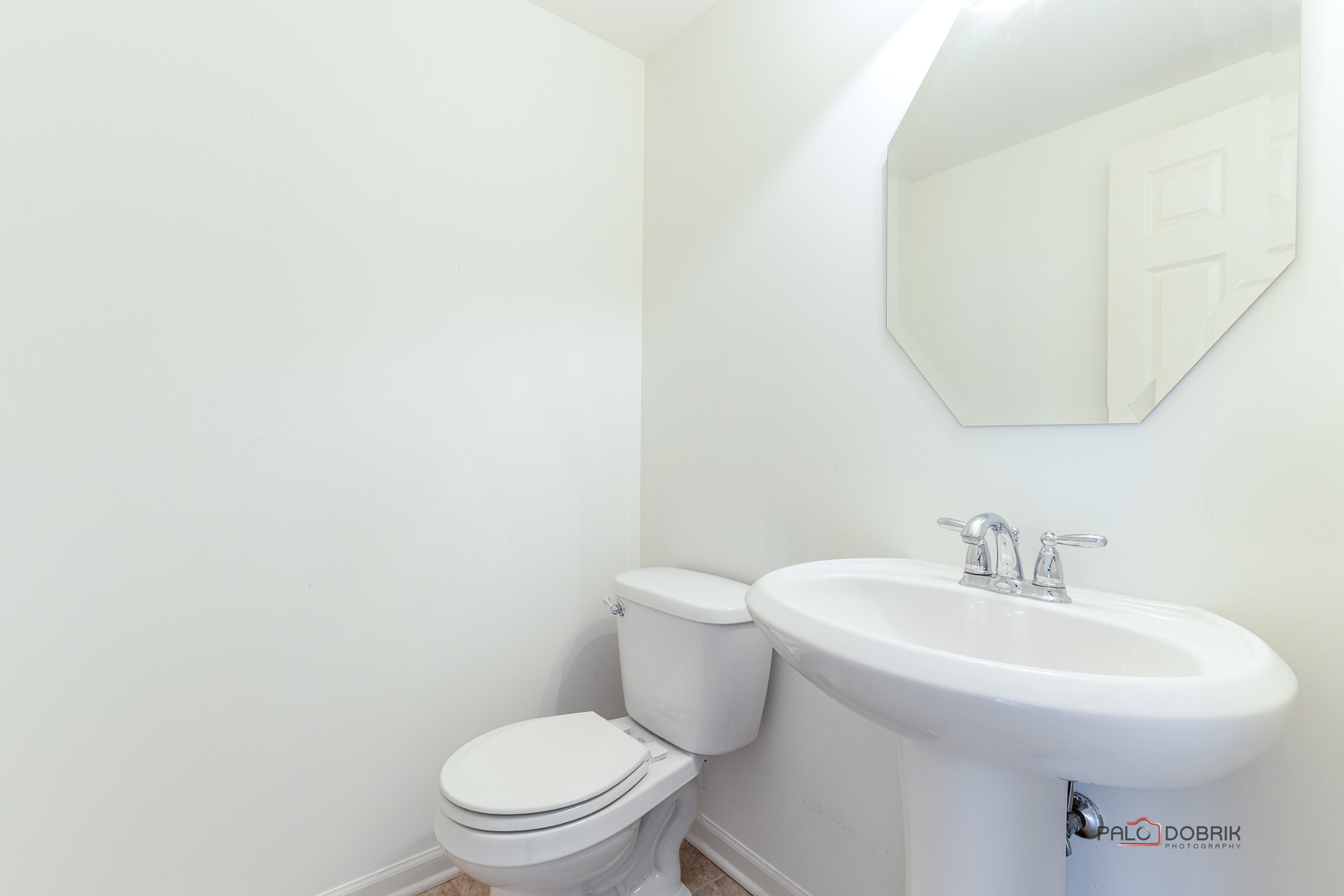 3410 Cameron Drive Elgin, IL 60124 - Photo 13 of 28 a bathroom with a sink a toilet and mirror