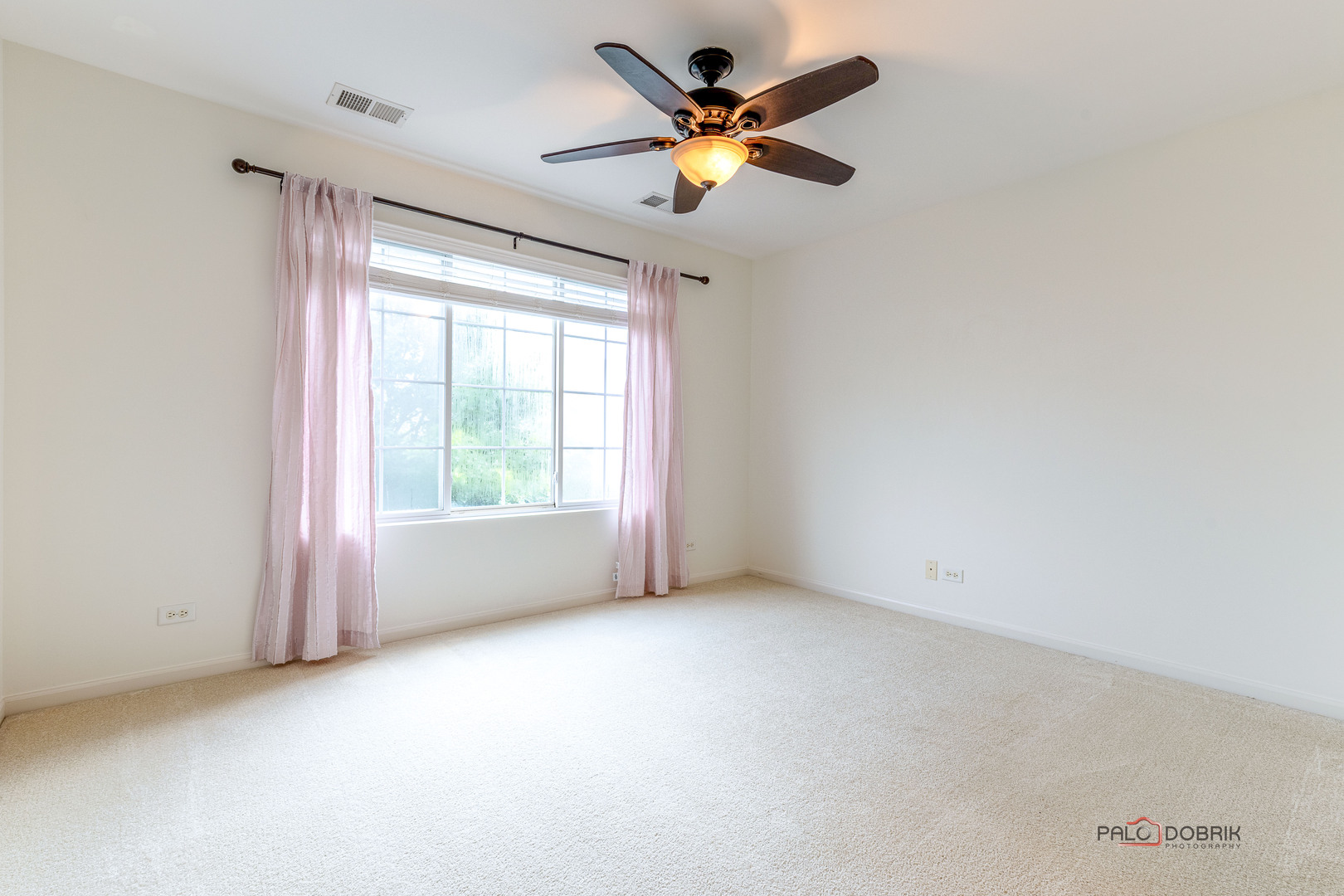 3410 Cameron Drive Elgin, IL 60124 - Photo 15 of 28 an empty room with a window and a fan