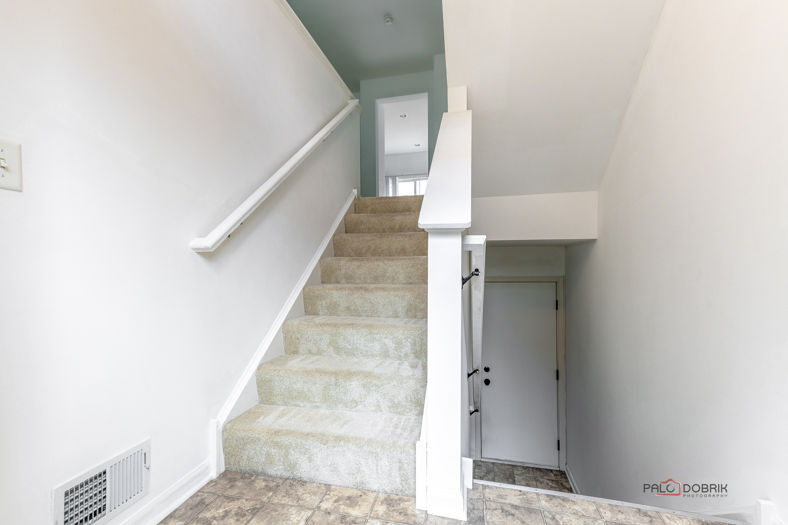 3410 Cameron Drive Elgin, IL 60124 - Photo 23 of 28 a view of staircase with white walls and white door