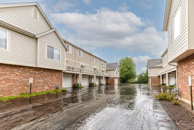 a front view of a house with garage