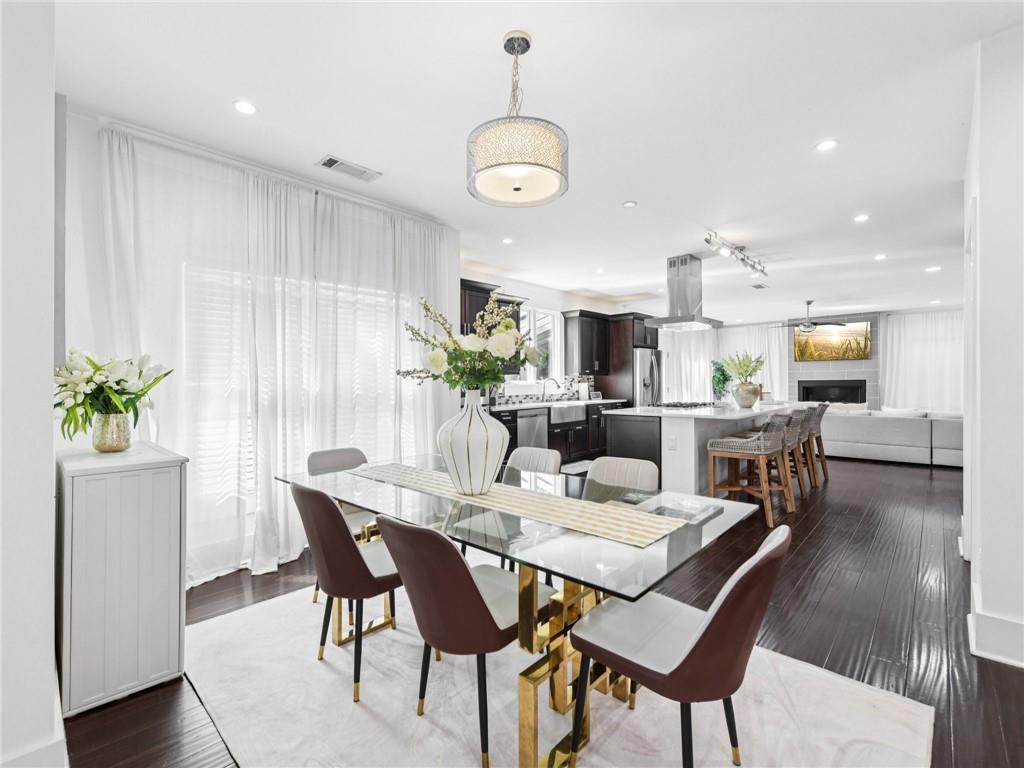 1399 North Druid Hills Road Northeast Atlanta, GA 30319 - Photo 18 of 58 a view of a dining room with furniture and wooden floor