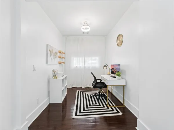 a bedroom with a bed and a chair