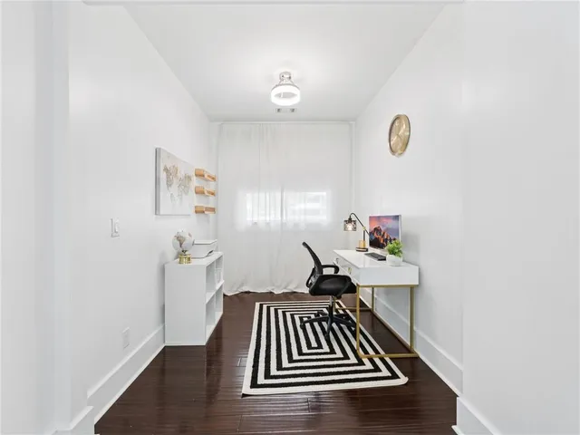 a bedroom with a bed and a chair