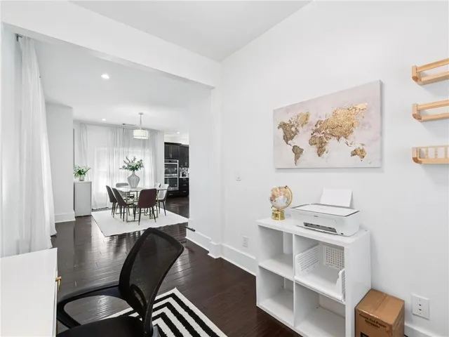 a bathroom with a sink a toilet and shower curtain