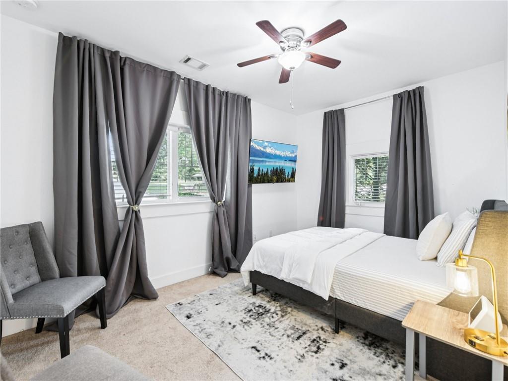 1399 North Druid Hills Road Northeast Atlanta, GA 30319 - Photo 23 of 58 a bedroom with a bed and a window