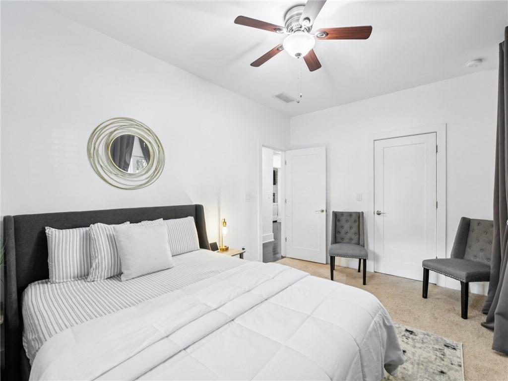 1399 North Druid Hills Road Northeast Atlanta, GA 30319 - Photo 24 of 58 a bedroom with a bed and a chair