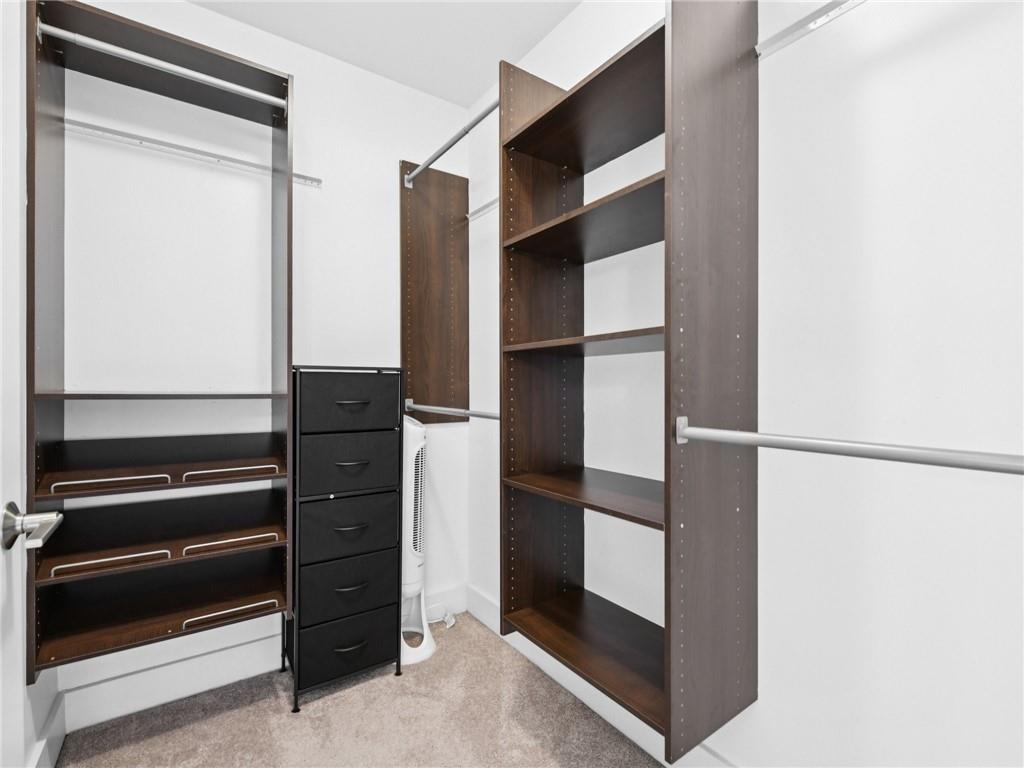1399 North Druid Hills Road Northeast Atlanta, GA 30319 - Photo 30 of 58 a view of walk in closet with empty racks