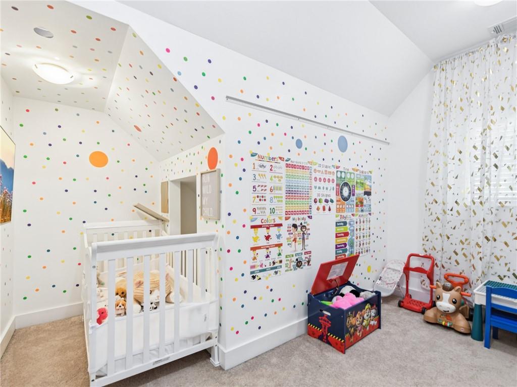 1399 North Druid Hills Road Northeast Atlanta, GA 30319 - Photo 31 of 58 a bedroom with furniture and a large window