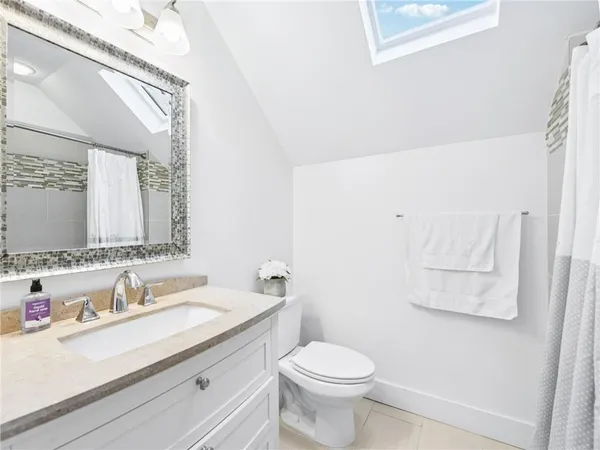 a kitchen with a refrigerator and a stove top oven