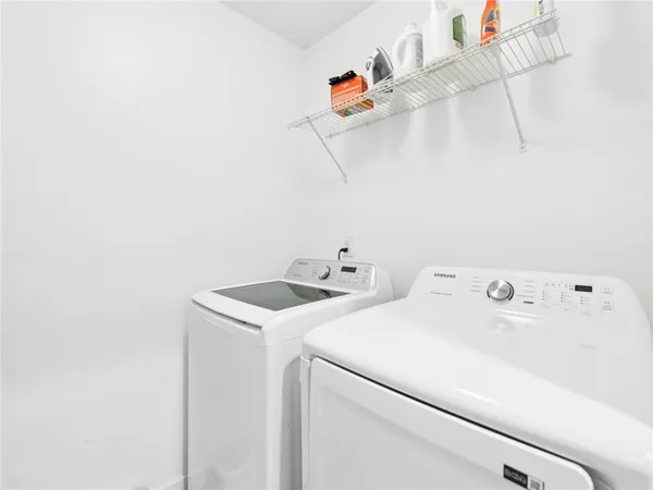 a kitchen with stainless steel appliances a refrigerator stove and microwave