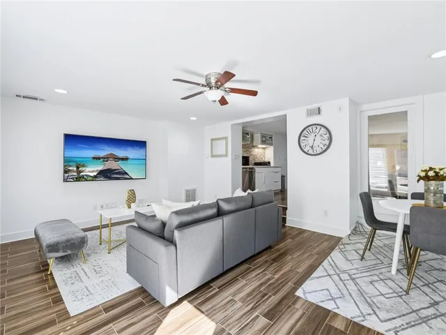 a bedroom with a bed and a large mirror