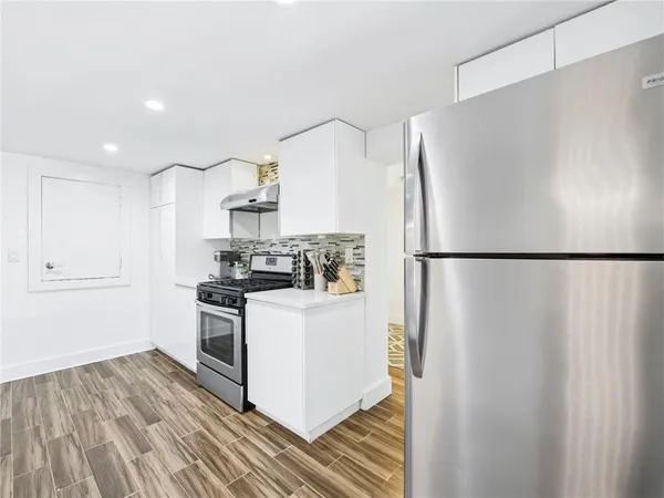 a view of a workspace with furniture