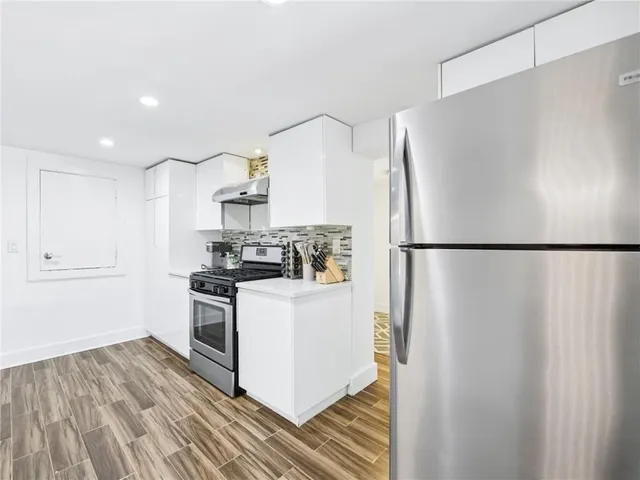 a view of a workspace with furniture