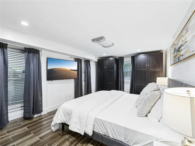 a view of balcony with wooden floor and outdoor seating