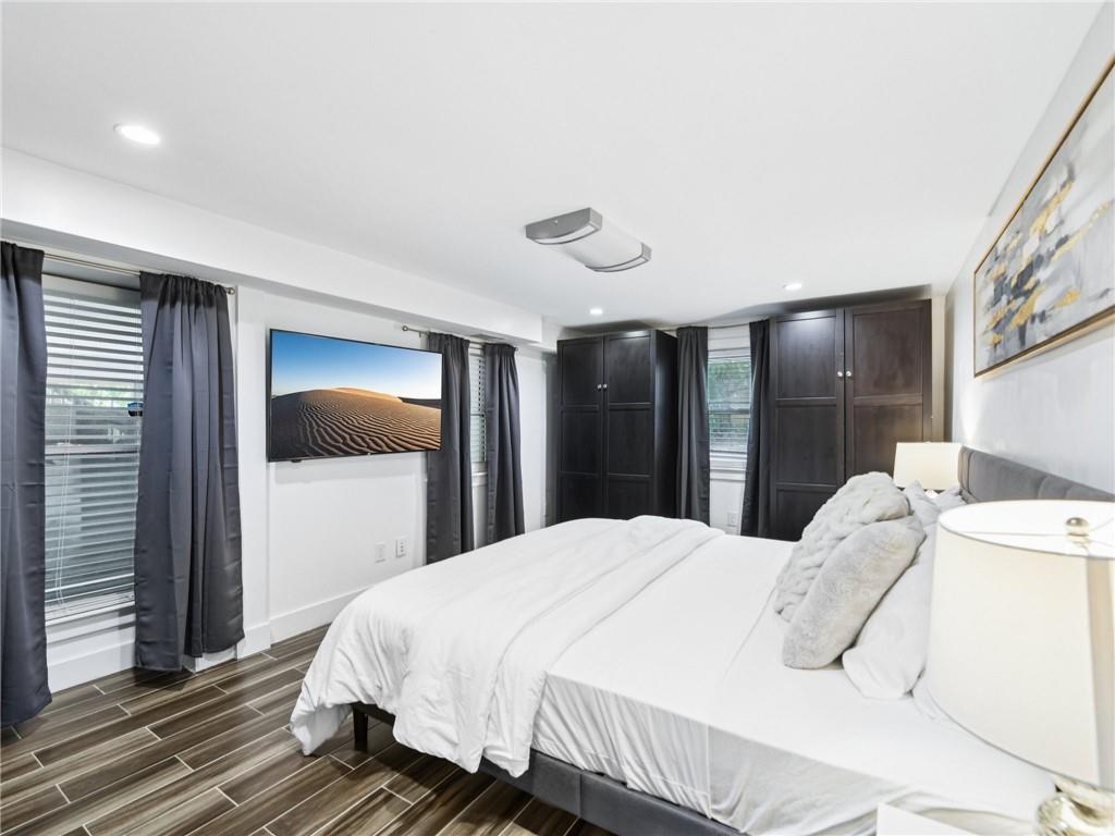 1399 North Druid Hills Road Northeast Atlanta, GA 30319 - Photo 46 of 58 a bedroom with a bed and a large mirror