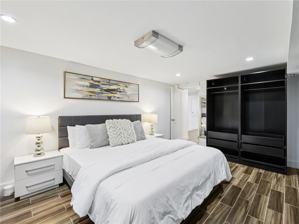 1399 North Druid Hills Road Northeast Atlanta, GA 30319 - Photo 47 of 58 a bedroom with a bed and a walk in closet