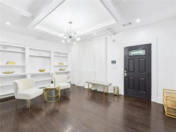 a view of a dining room with furniture and wooden floor