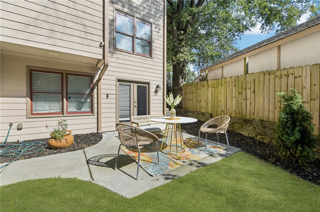 1399 North Druid Hills Road Northeast Atlanta, GA 30319 - Photo 54 of 58 a view of a chair and table in backyard