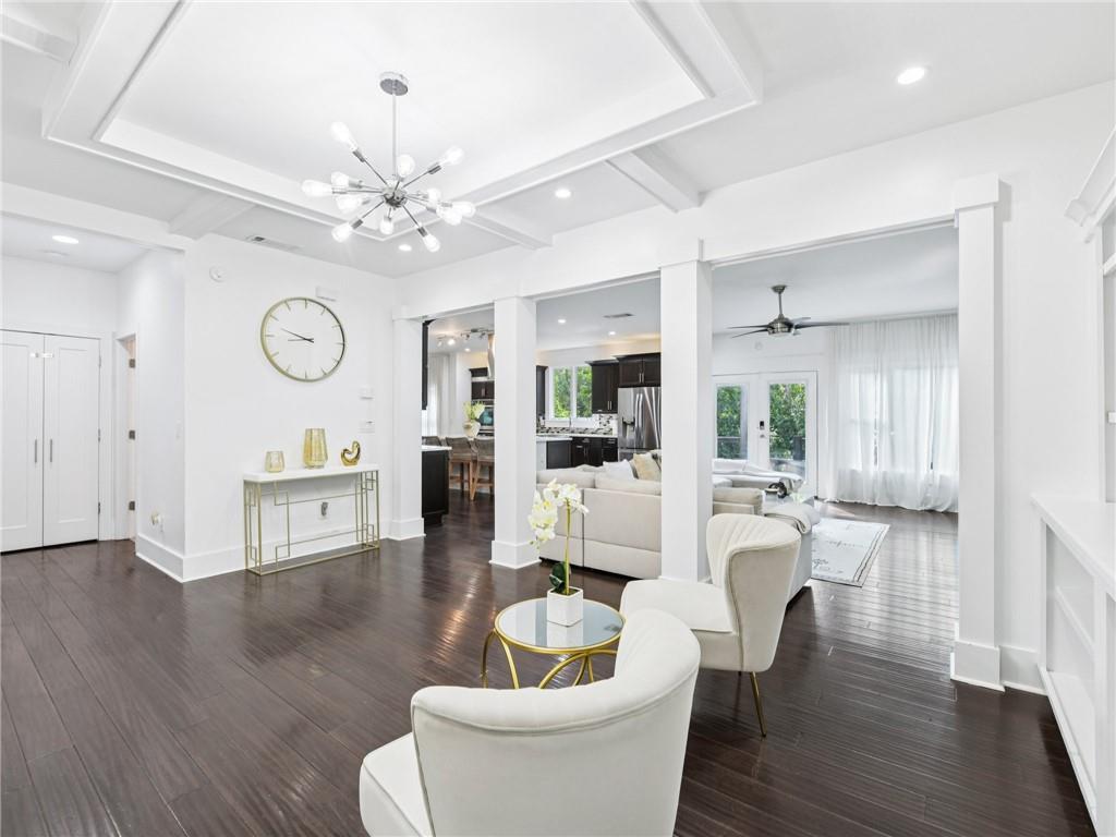 1399 North Druid Hills Road Northeast Atlanta, GA 30319 - Photo 8 of 58 a living room with furniture a table and wooden floor