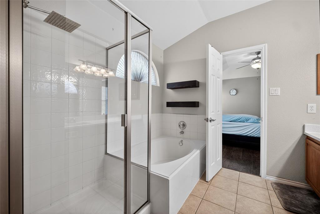 9633 Anns Way Plano, TX 75025 - Photo 20 of 37 a en suite bathroom with a granite countertop sink a toilet and shower
