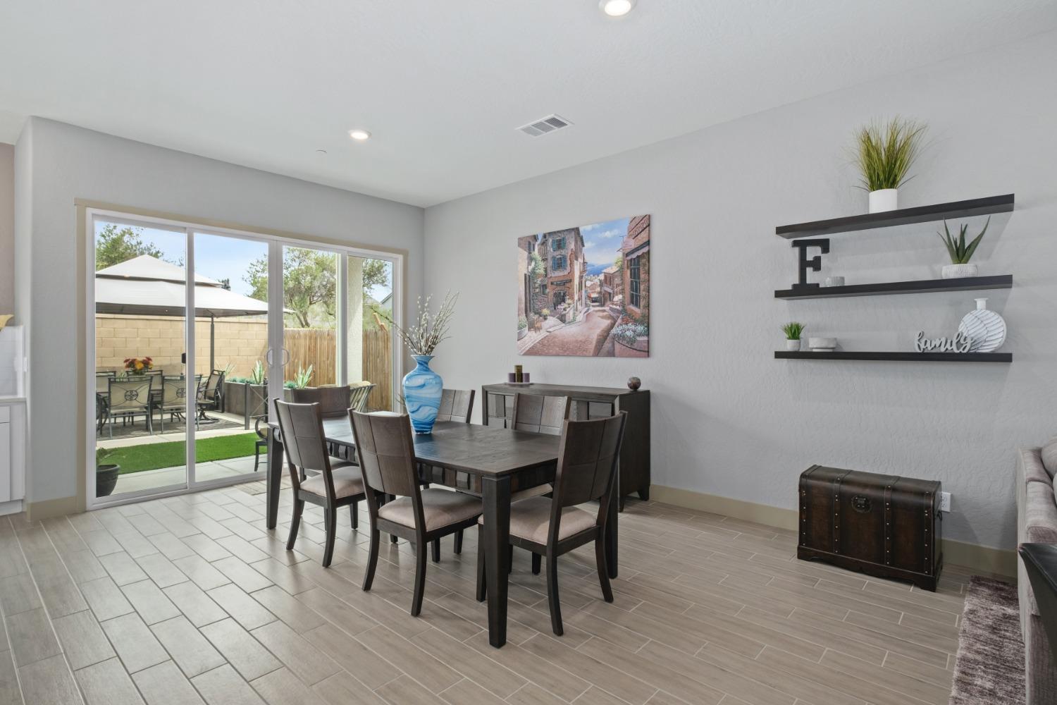 859 Maclure Avenue Madera, CA 93636 - Photo 11 of 53 a view of a dining room with furniture window and outside view