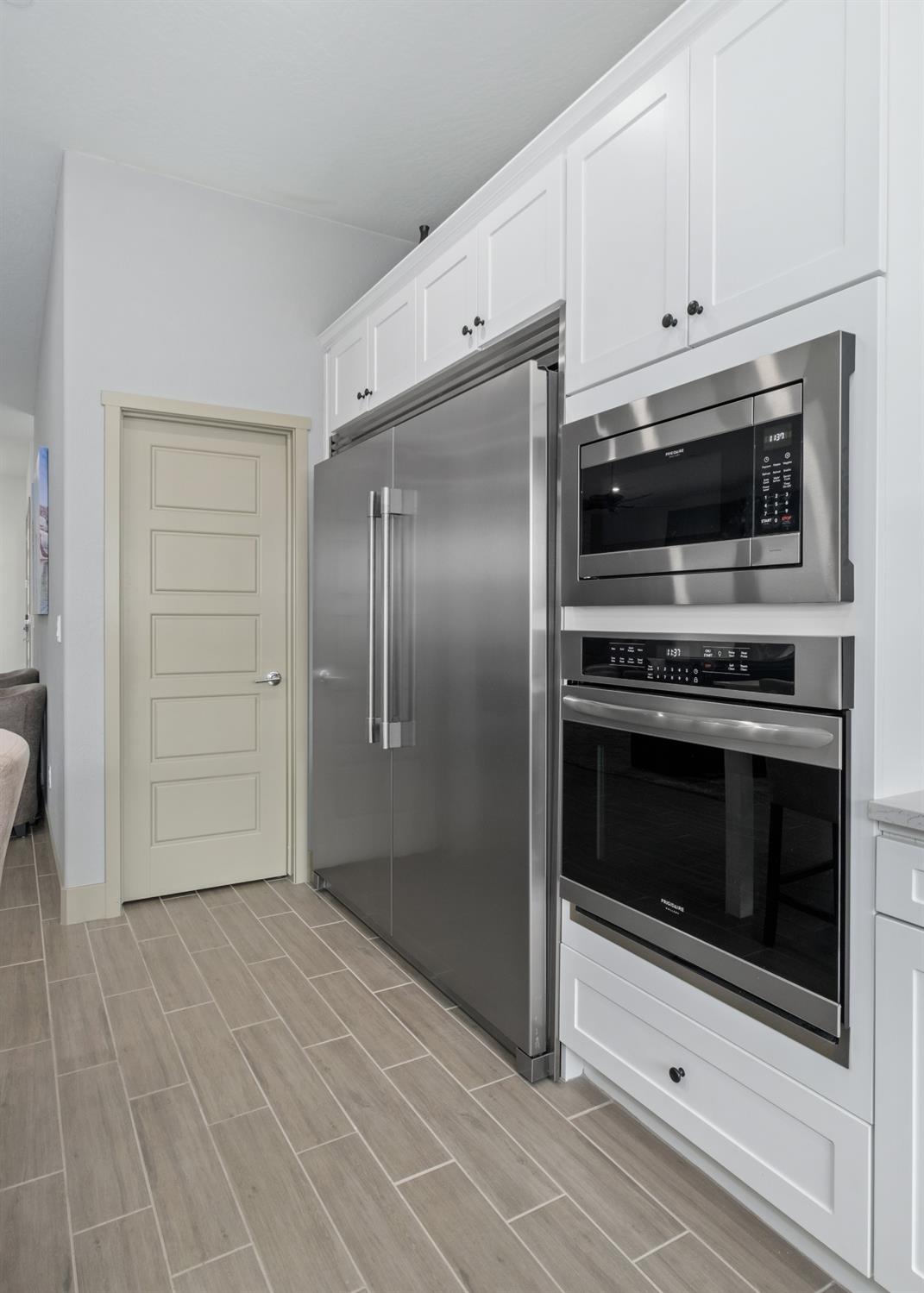 859 Maclure Avenue Madera, CA 93636 - Photo 15 of 53 a kitchen with granite countertop a stove and a microwave