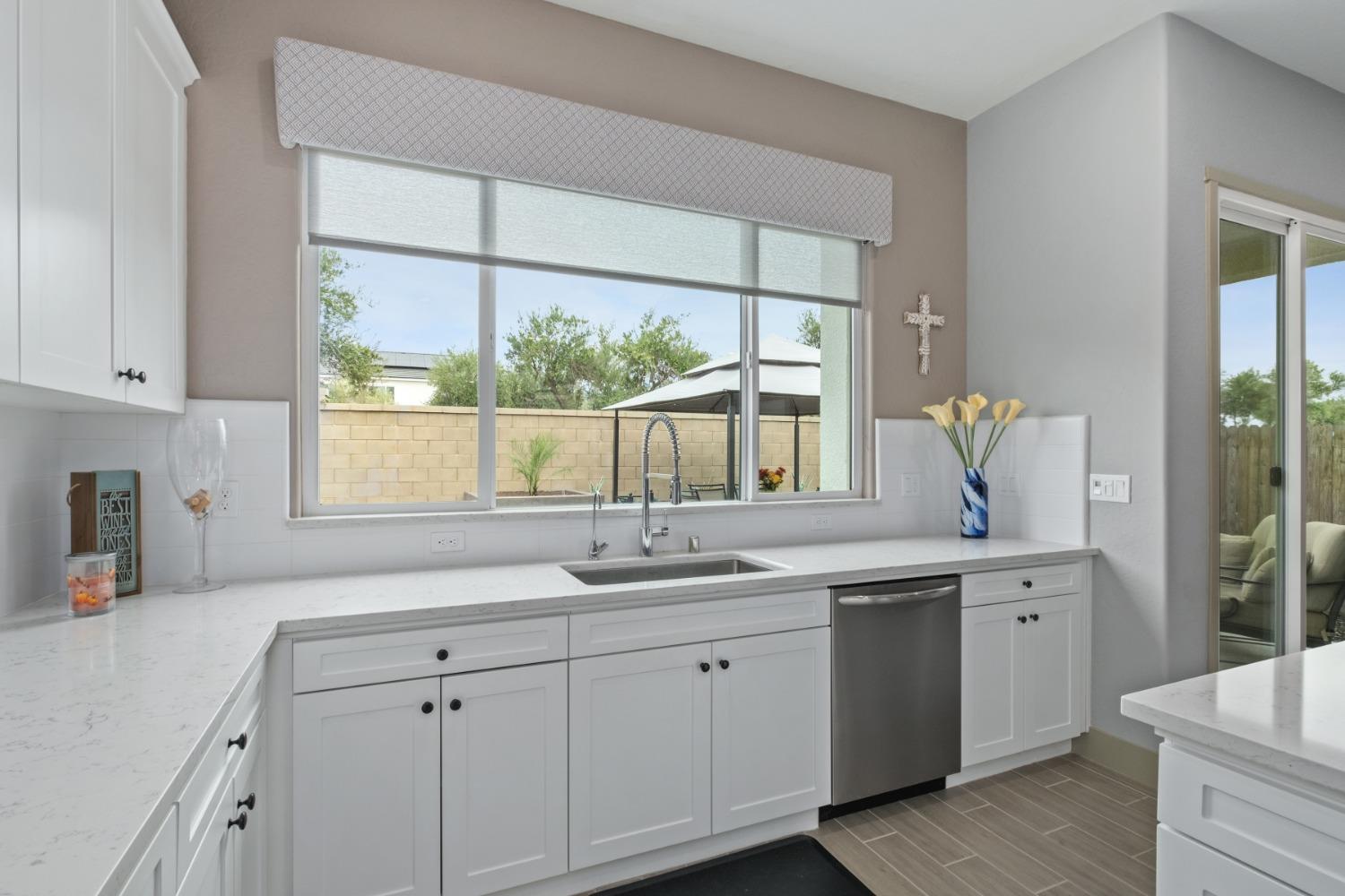 859 Maclure Avenue Madera, CA 93636 - Photo 17 of 53 a kitchen with a sink and window