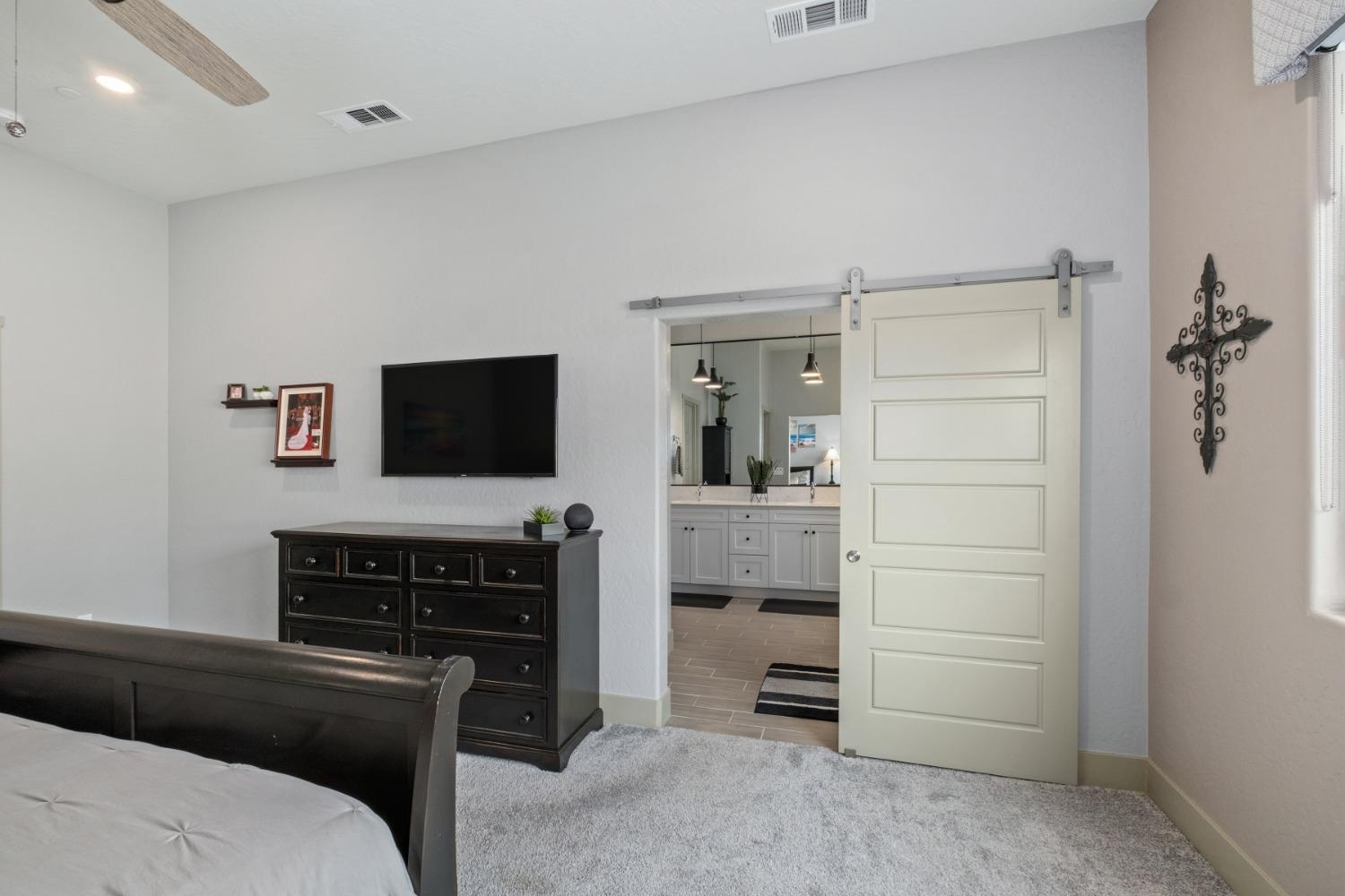 859 Maclure Avenue Madera, CA 93636 - Photo 20 of 53 a living room with furniture and a flat screen tv