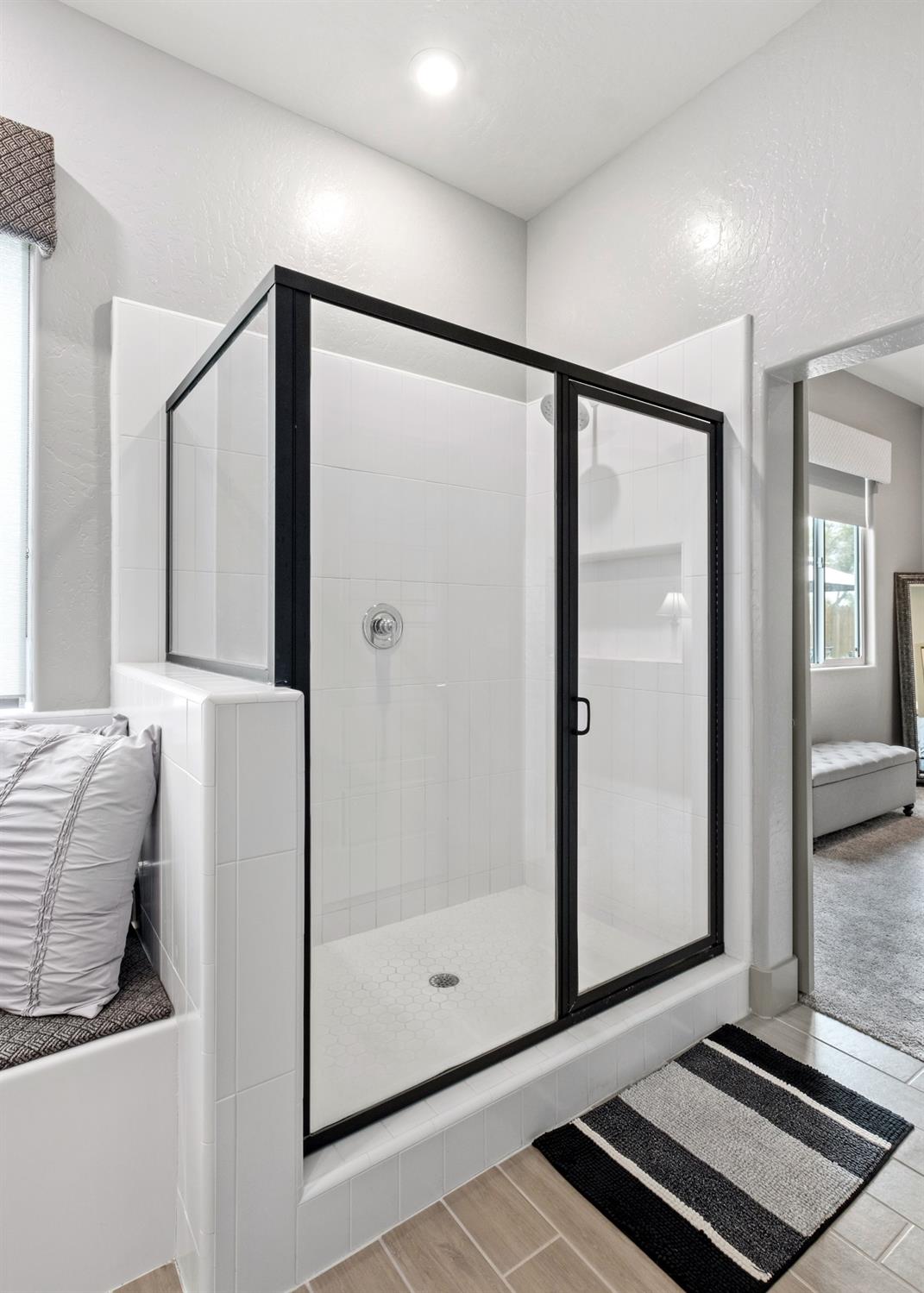 859 Maclure Avenue Madera, CA 93636 - Photo 22 of 53 a bathroom with a glass shower door