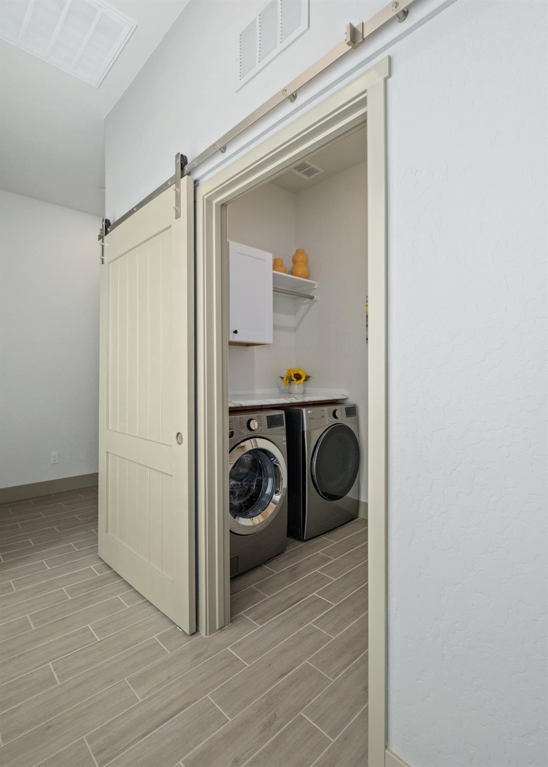 859 Maclure Avenue Madera, CA 93636 - Photo 30 of 53 a utility room with dryer and washer