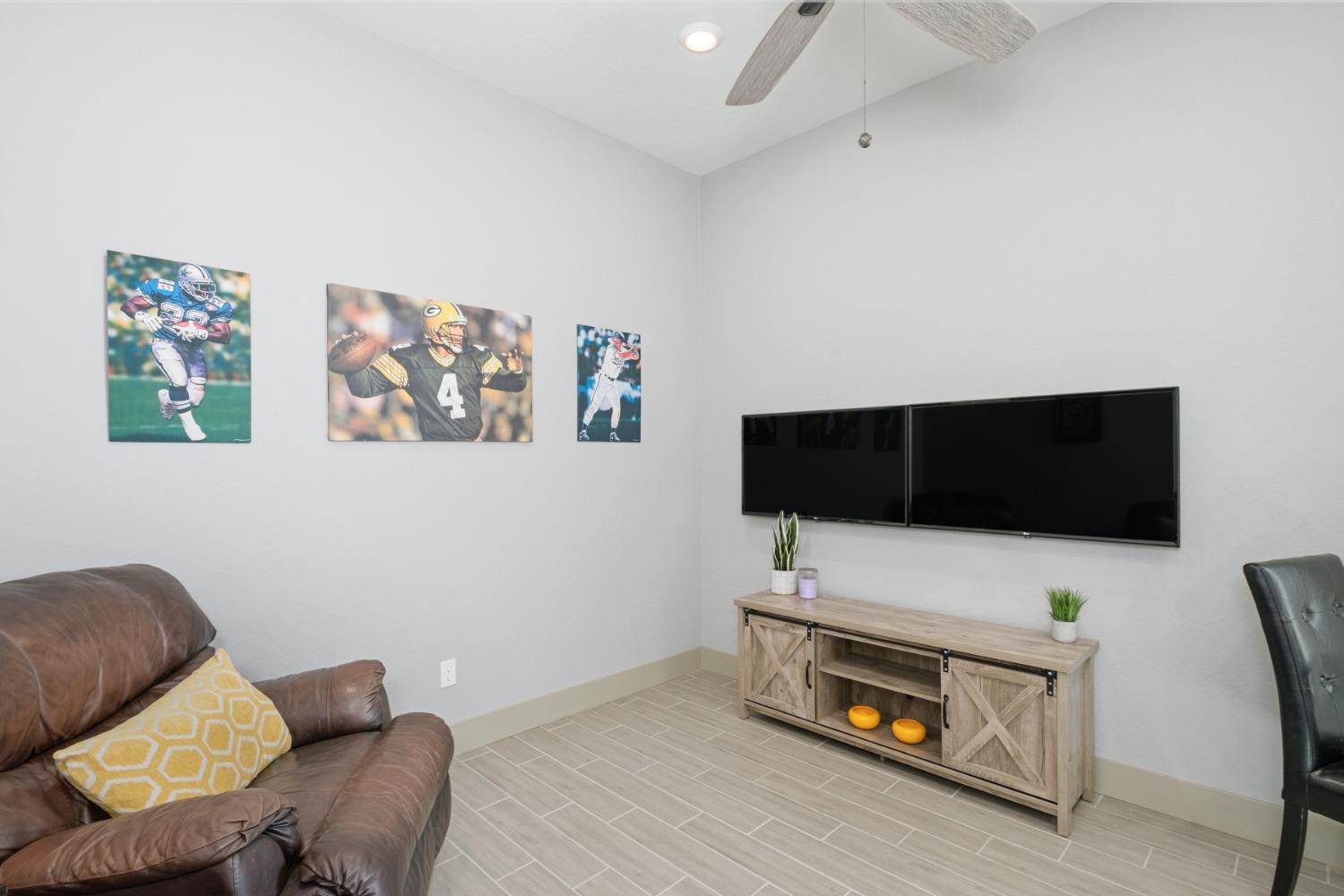 859 Maclure Avenue Madera, CA 93636 - Photo 34 of 53 a living room with furniture and a flat screen tv
