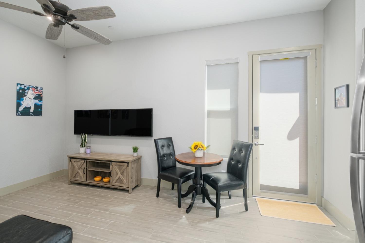 859 Maclure Avenue Madera, CA 93636 - Photo 36 of 53 a living room with furniture and a flat screen tv