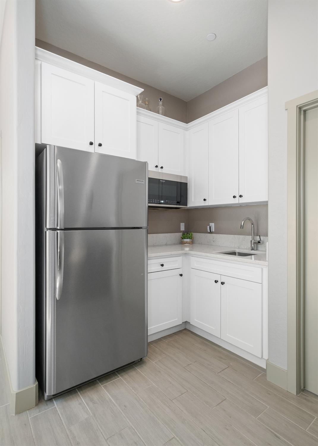 859 Maclure Avenue Madera, CA 93636 - Photo 38 of 53 a kitchen with appliances a sink and lots of cabinets