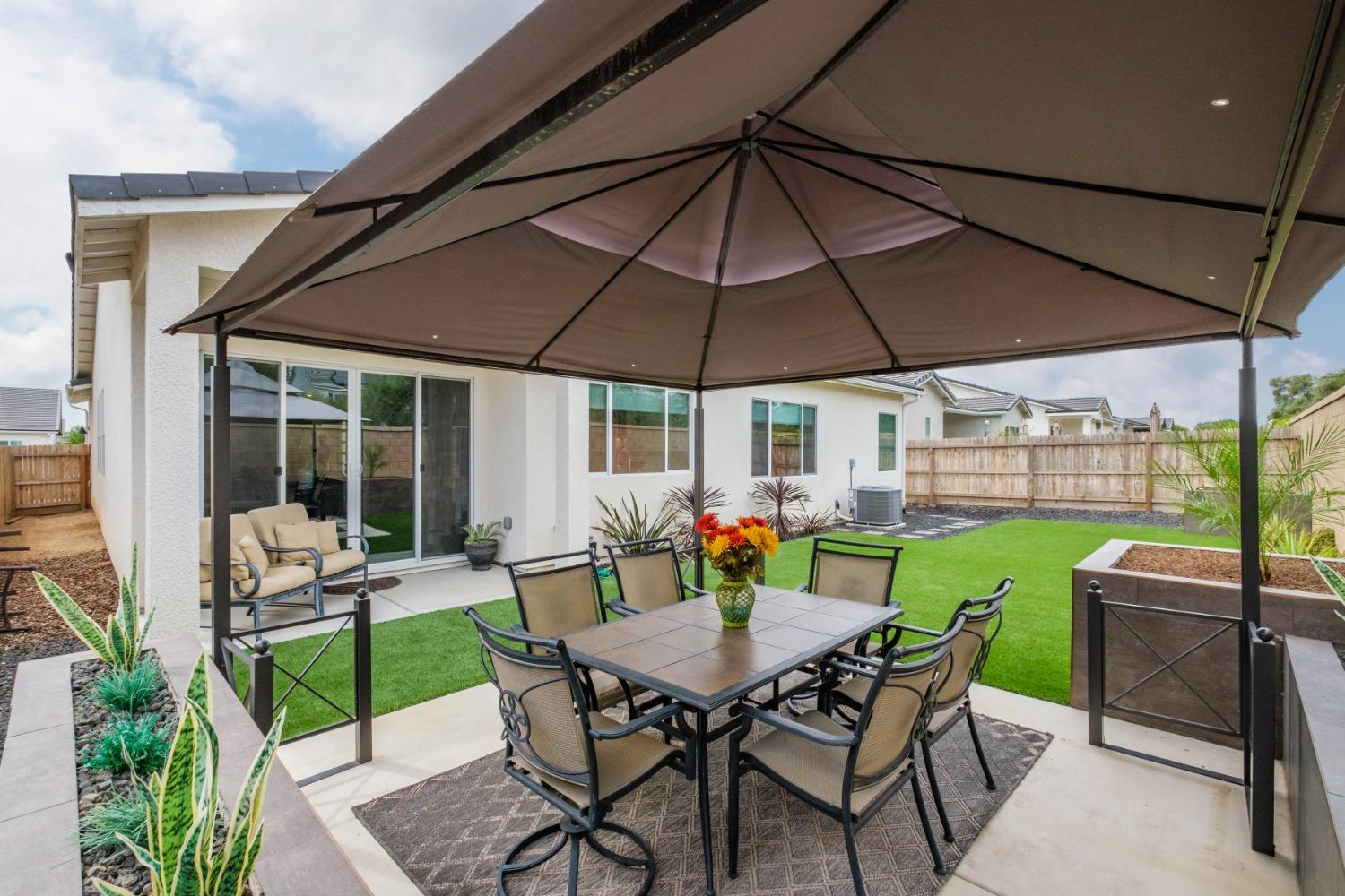 859 Maclure Avenue Madera, CA 93636 - Photo 44 of 53 a view of an outdoor sitting area with furniture and backyard