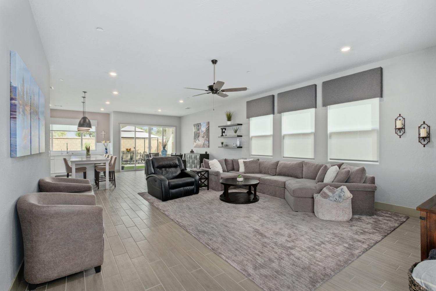 859 Maclure Avenue Madera, CA 93636 - Photo 8 of 53 a living room with furniture and a large window