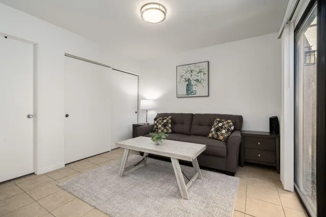 a living room with furniture and a window
