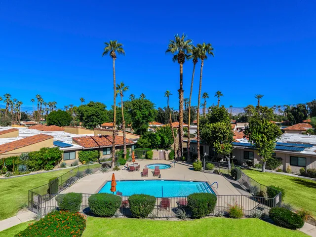 a front view of a building with garden